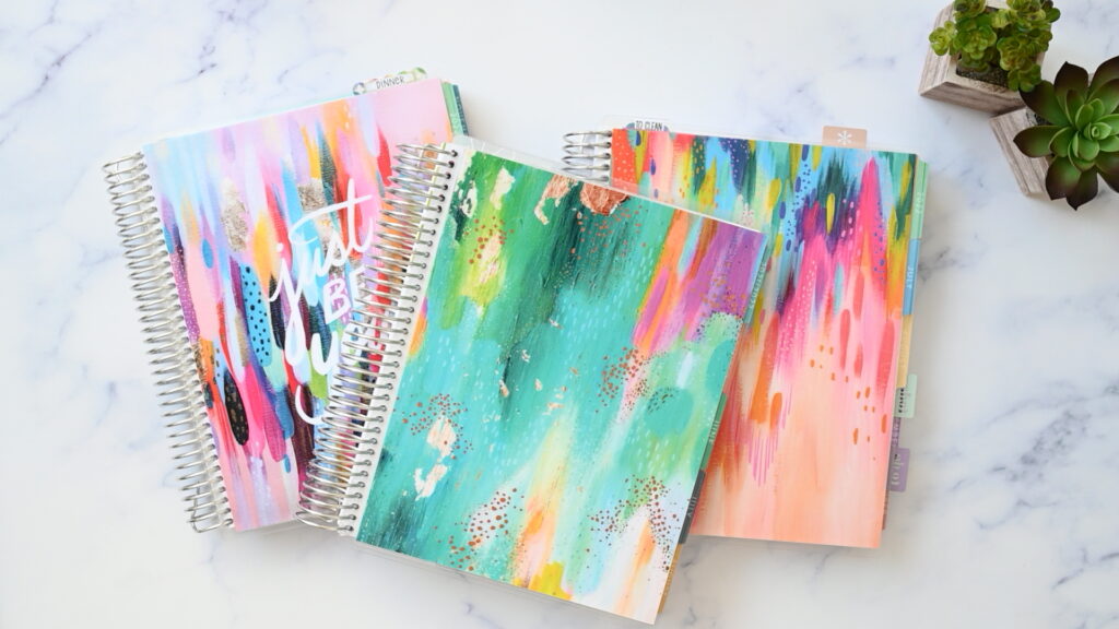 A stack of three planners to show Erin Condren for Beginners